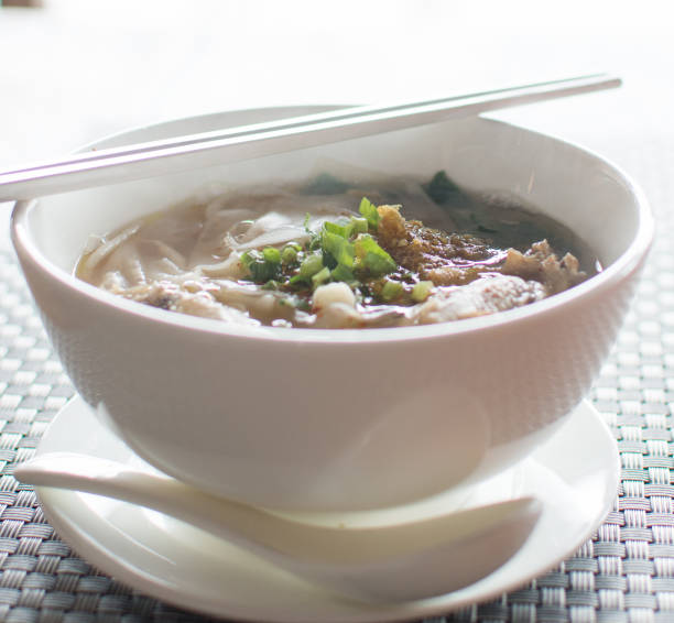 istock thai chicken noodles  on table 1190957117