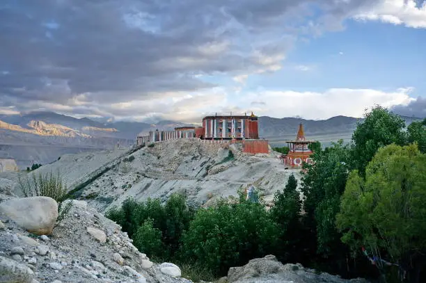 Photo of Tsarang Gompa rises on a hill - a monastery of the Sakya sect, built in 1395.