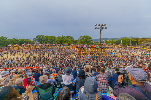 Niihama, Japan - October 17, 2019: Wide view of the Niihama Taiko Festival scene, with taikodai drum floats, participants and crowd, Ehime, Shikoku Island, Japan