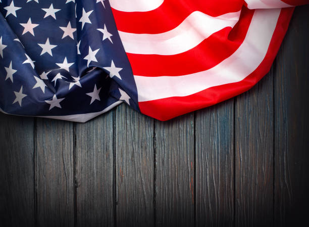 istock US flag on wooden background. 1190970824