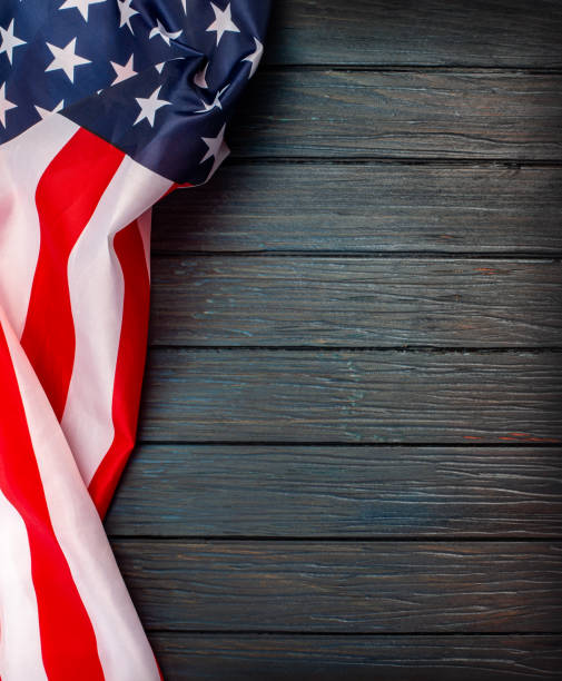 istock US flag on wooden background. 1190970829