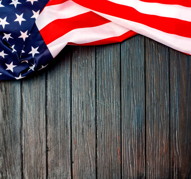 istock US flag on wooden background. 1190970833
