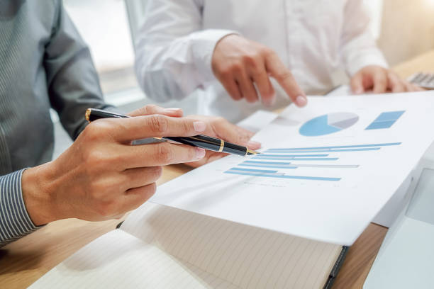 istock Business team brainstorming and discussing with financial data and report graph. Teamwork meeting working concept. 1190972958