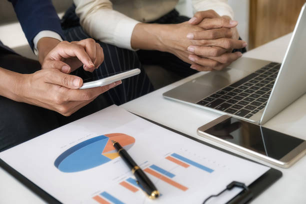 istock Business team brainstorming and discussing with financial data and report graph. Teamwork meeting working concept. 1190974482