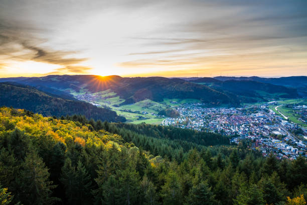germany, wide panorama view over black forest village haslach in kinzigtal above green tree tops at sunset, a hiking paradise - forest black forest sky night imagens e fotografias de stock