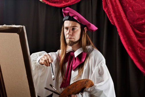 Fine art painter wearing a renaissance clothing, holding artist pallete while painting a canvas on an easel. 