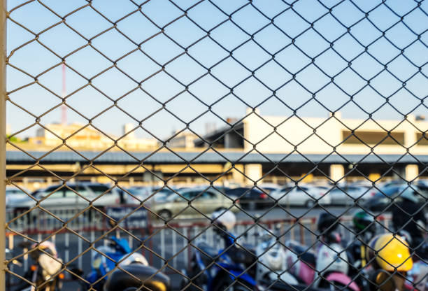 istock metal net wall for car park secure concept background 1190977198