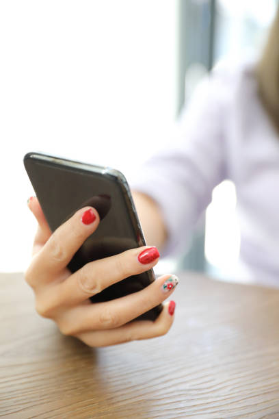 istock Woman hand using smart phone in business 1190978840