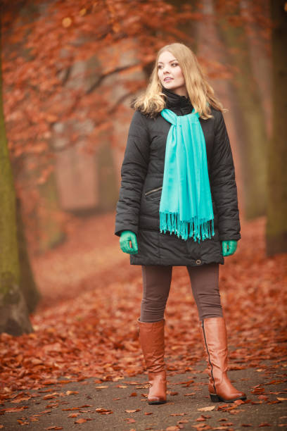 istock Girl is walking through the park. 1190979191
