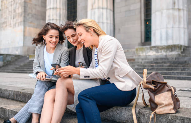 istock Female Law Student Friends Checking Smart Phone on Break 1190982046