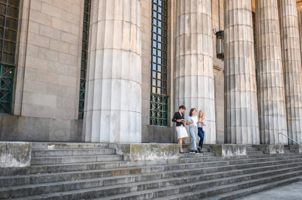 istock Female Law Students Departing Neo-Classical School Building 1190982077
