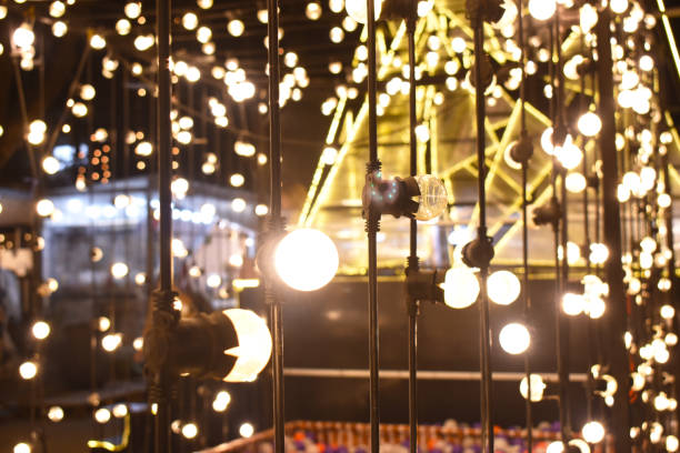 istock shiny light from electric bulb in the dark night 1190983771