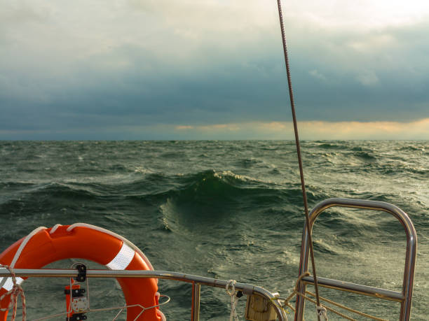istock Seascape before storm, dark clouds, life buoy 1190985552