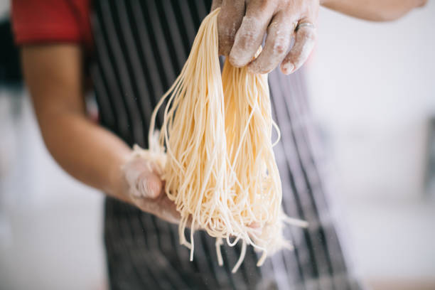 istock Making Handmade Noodles on wood background 1190988286