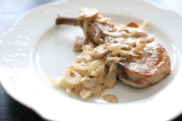 istock Pork chop with mushroom sauce 1190990314