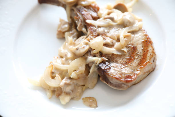 istock Pork chop with mushroom sauce 1190990315