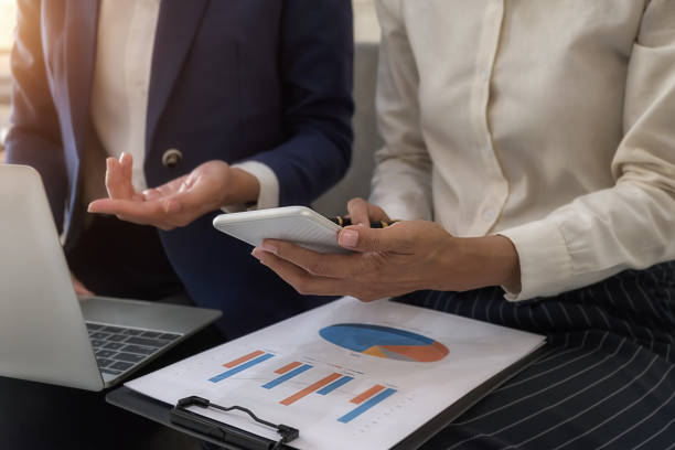 istock Business team brainstorming and discussing with financial data and report graph. Teamwork meeting working concept. 1190992780