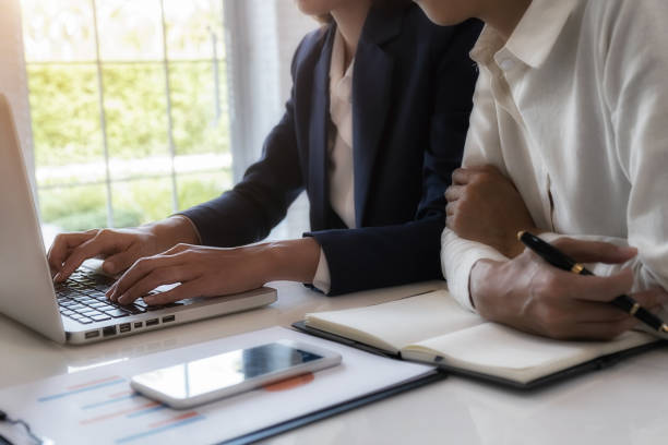 istock Business team brainstorming and discussing with financial data and report graph. Teamwork meeting working concept. 1190992782