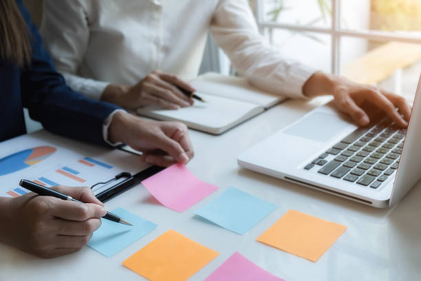istock Business team brainstorming and discussing with financial data and report graph. Teamwork meeting working concept. 1190992790