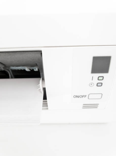 istock Modern air condition unit on a white wall inside the living room. 1190994774