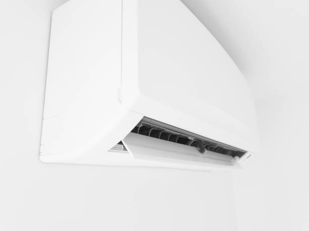 istock Modern air condition unit on a white wall inside the living room. 1190994797