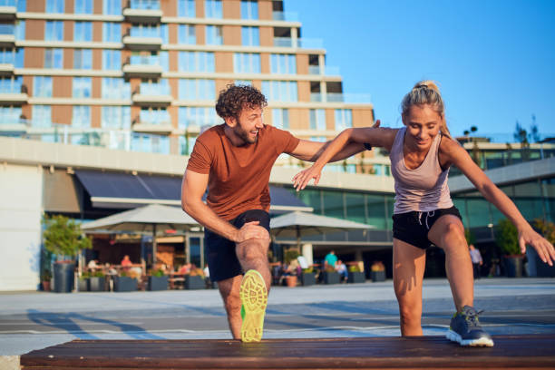 istock Modern couple doing exercise in urban area. 1190995391