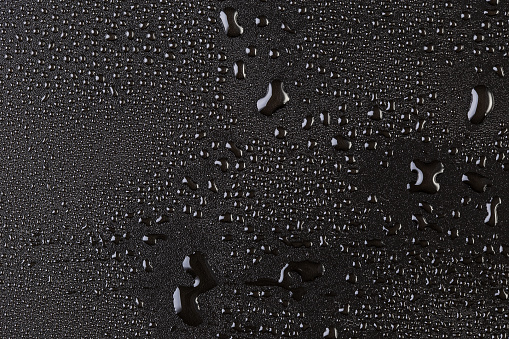 The resulting ripples caused by raindrops on the water's surface.