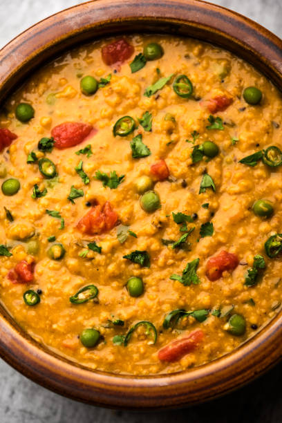 istock Vegetable masala oats khichadi served in a bowl. selective focus 1191001760