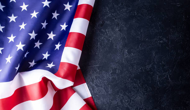 istock Usa flag on dark background 1191001804