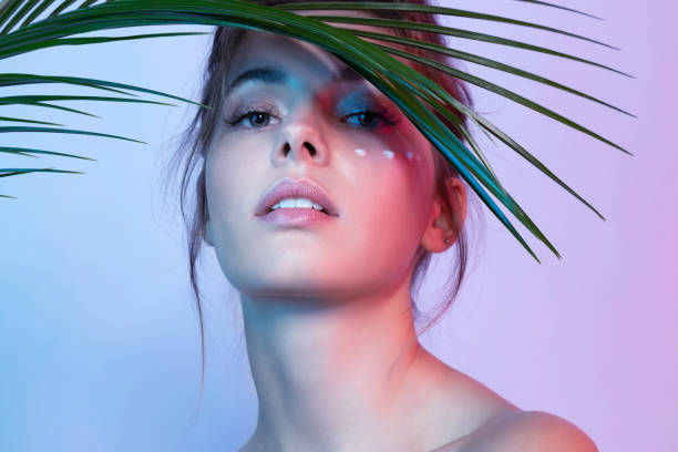 istock Pretty lady with anti-aging cream on face 1191012906