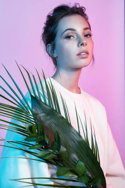 istock Perfect lady posing with tropical trees 1191013019