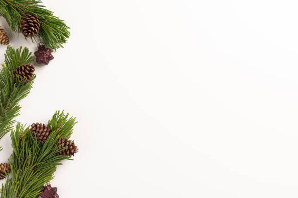 istock Christmas composition. Spruce branches with cones and christmas decorations, on a white background. Christmas, winter, new year concept. Flat lay, top view, copy space. 1191013977