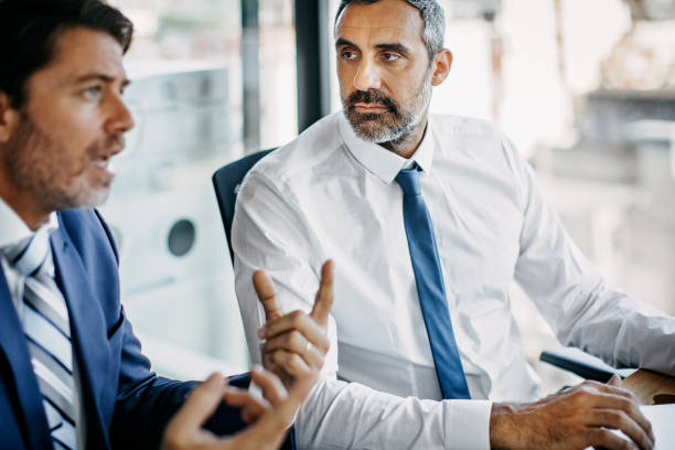 istock Two businessman discussing at office meeting 1191020617