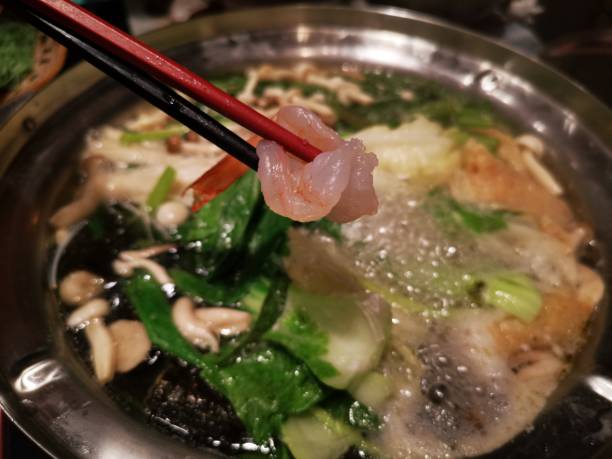 Fat bubbles floating on Shabu soup with pork