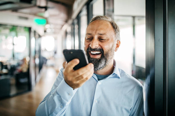 istock Businessman talking on mobile phone at office 1191020973