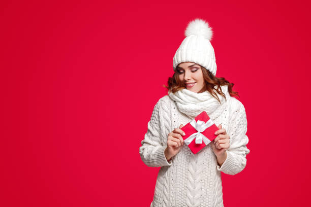 istock Happy young woman with small present 1191024680