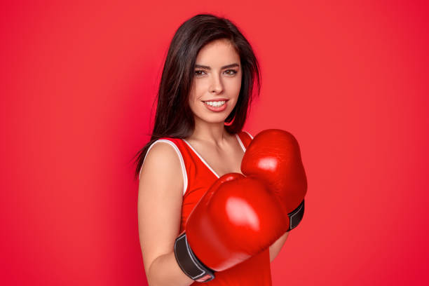 istock Smiling female boxer in gloves 1191024718