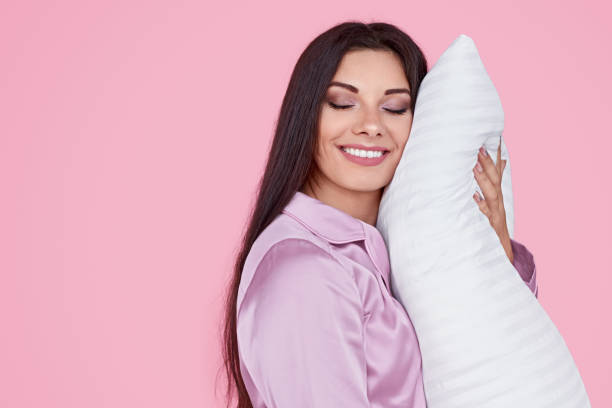 istock Happy woman enjoying good sleep 1191024748