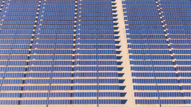 istock AERIAL: Empty path leads across solar panel electricity plant deep in the desert 1191024860