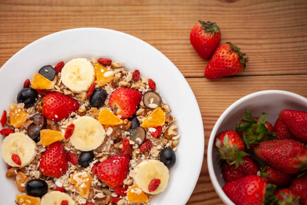 istock Close-up of healthy oats breakfast with various fruit toppings. 1191025472