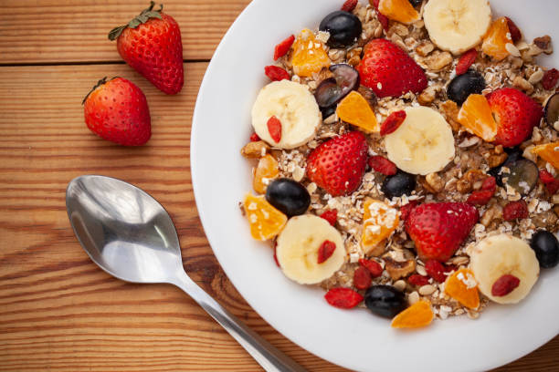 istock Close-up of healthy oats breakfast with various fruit toppings. 1191025473