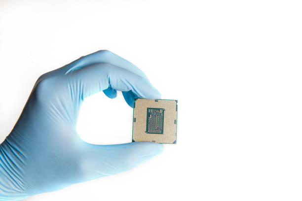 istock Hand in blue gloves holds cpu, close up. 1191026361
