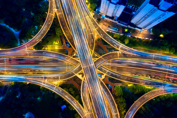 istock Urban highway traffic shanghai at night 1191026892