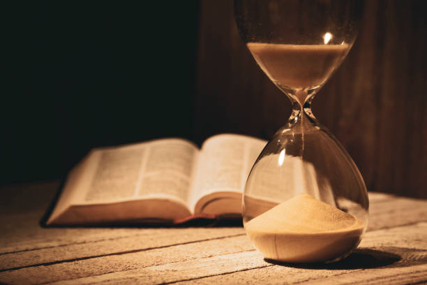 Time is running out hourglass concept Time is running out according to the Bible. Christian photography. apocalypse stock pictures, royalty-free photos & images