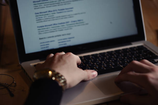 istock Man hands working laptop at office, dark theme 1191029785