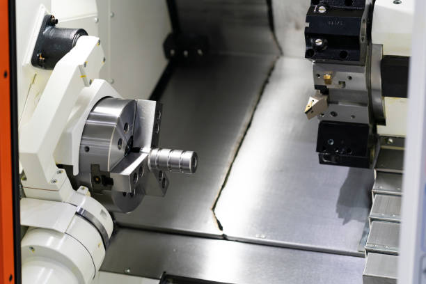 istock Operator machining automotive part by cnc turning machine, 1191030806