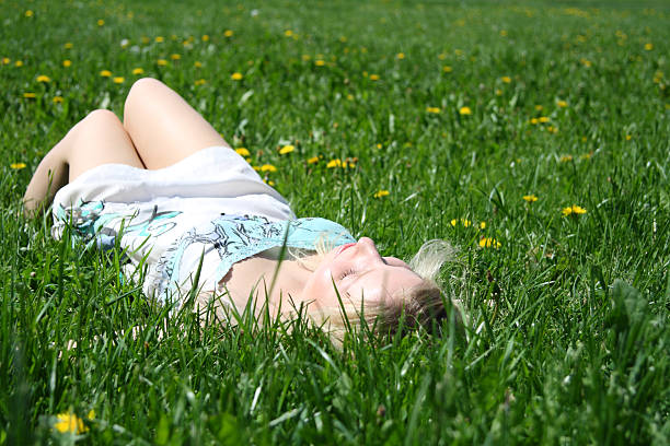 istock woman on the green grass 119103117