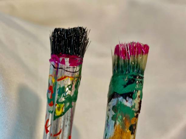 istock Paint spattered paint brush 1191032398