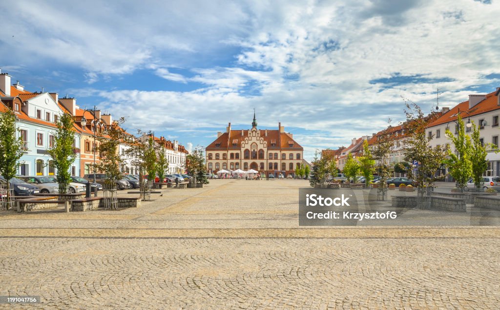 Market square in Pisz with the historic town hall, Masuria, Poland. The historic market square in the Masurian town of Pisz with the neo-gothic town hall built in 1900. City Stock Photo