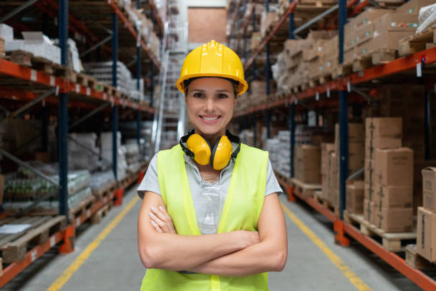 istock Happy woman working at a warehouse 1191045859